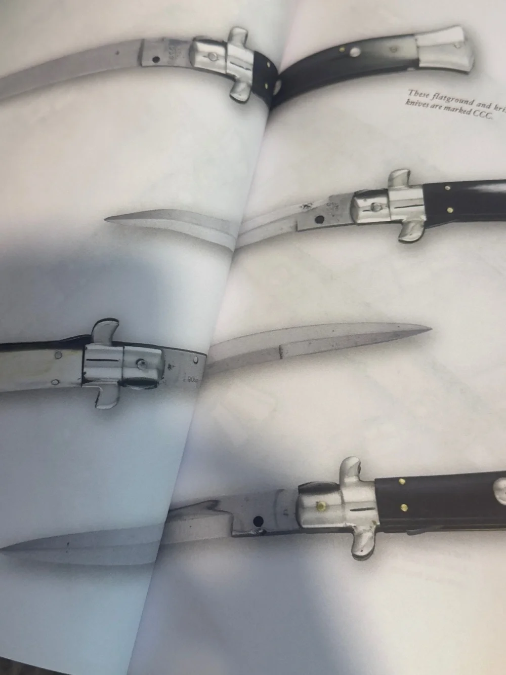 Firearms Reference Guide Book - Brown and Silver guns knive book